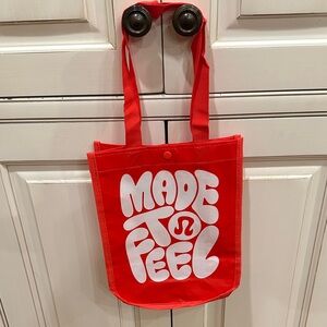 LULULEMON ATHLETICA RED AND WHITE "MADE TO FEEL" REUSABLE TOTE BAG
